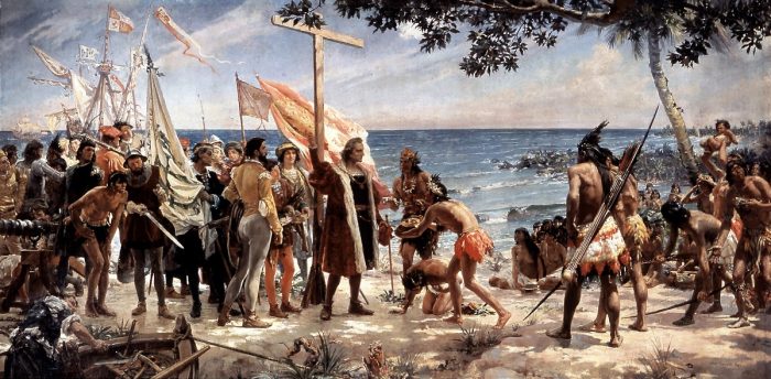 Cristobal Colon con una cruz frente a los nativos