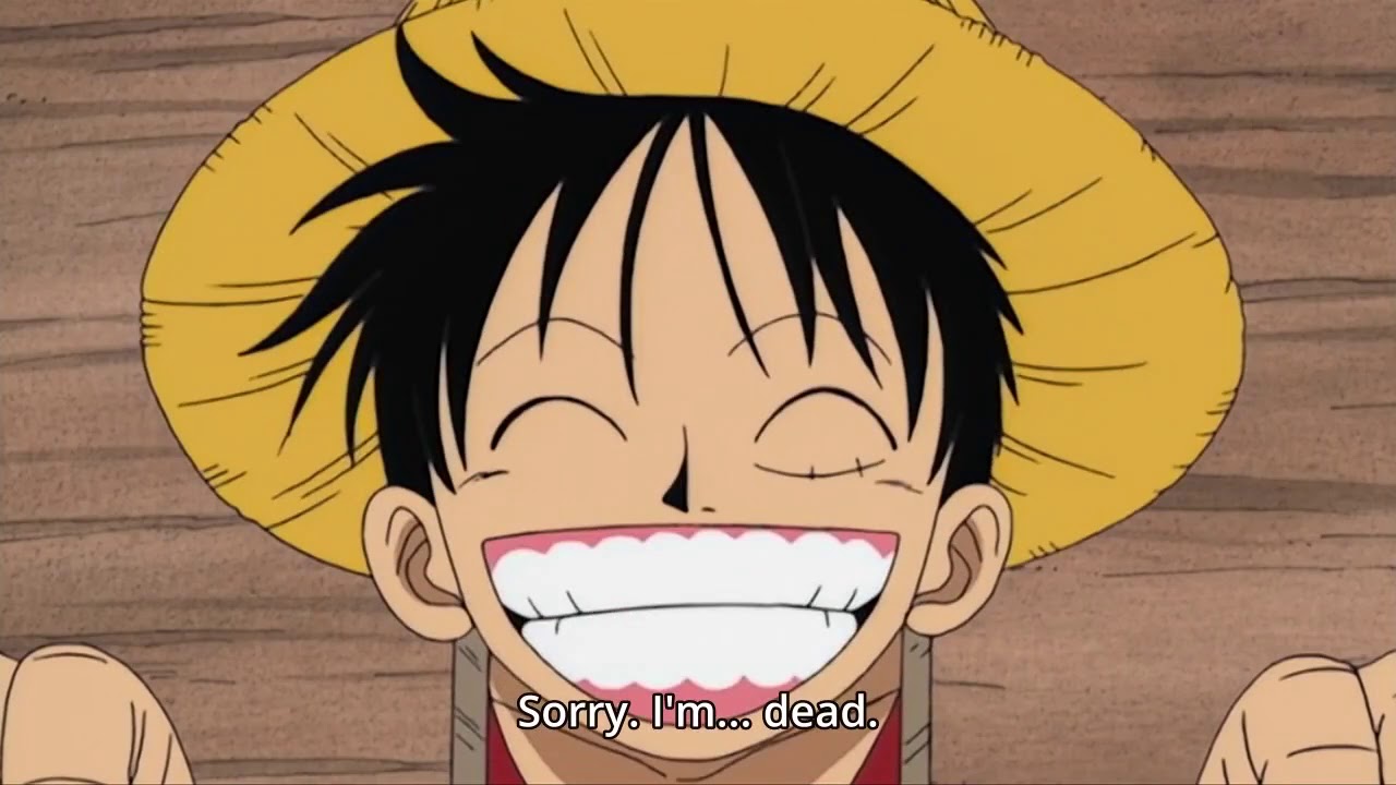 Luffy sonriendo antes de ser ejecutado
